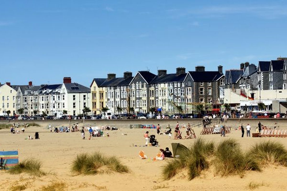 A wide sandy beach on a bright day