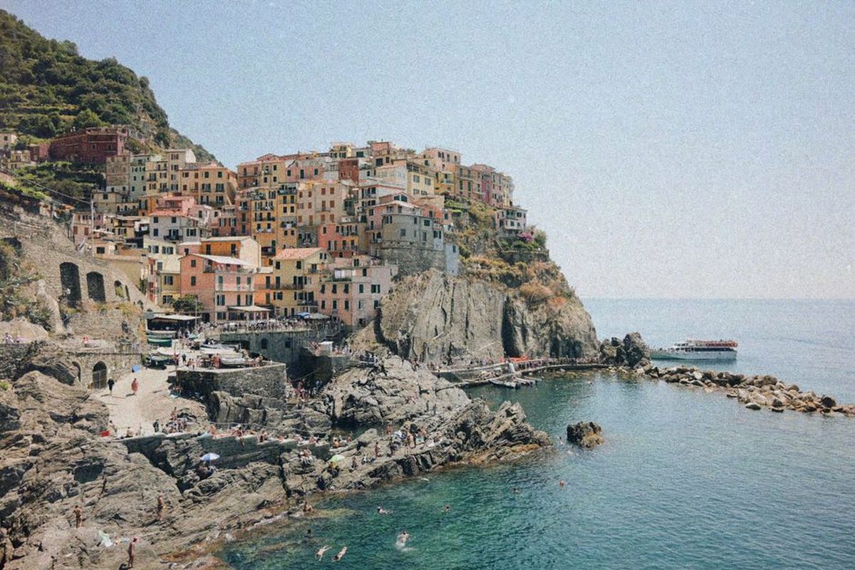A colourful village on a Mediterranean clifftop