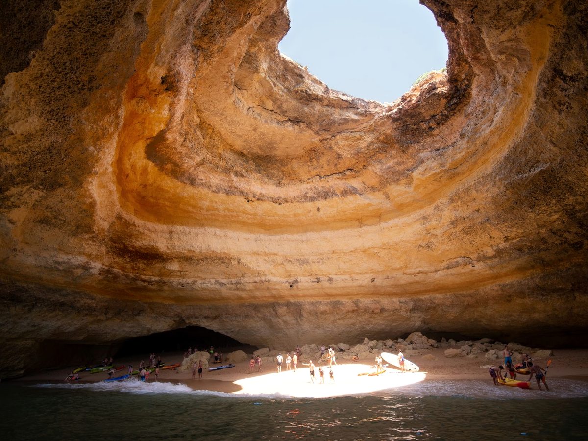 Inside the Benagil cave, lit through the opening in its roof