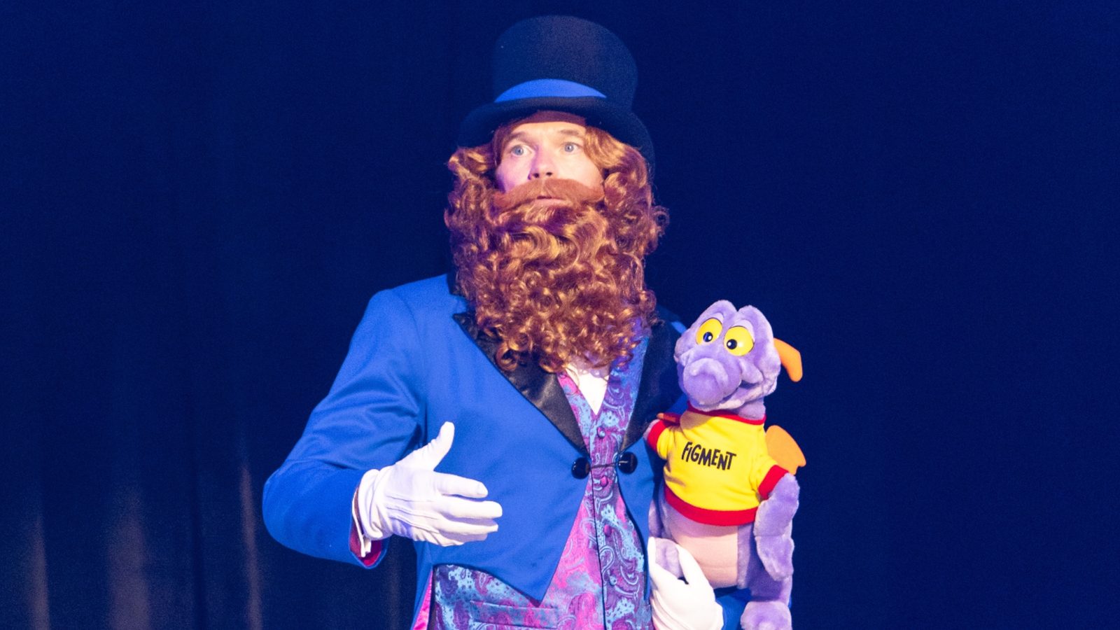 Dreamfinder standing with Figment during Disney’s D23 2026 presentation
