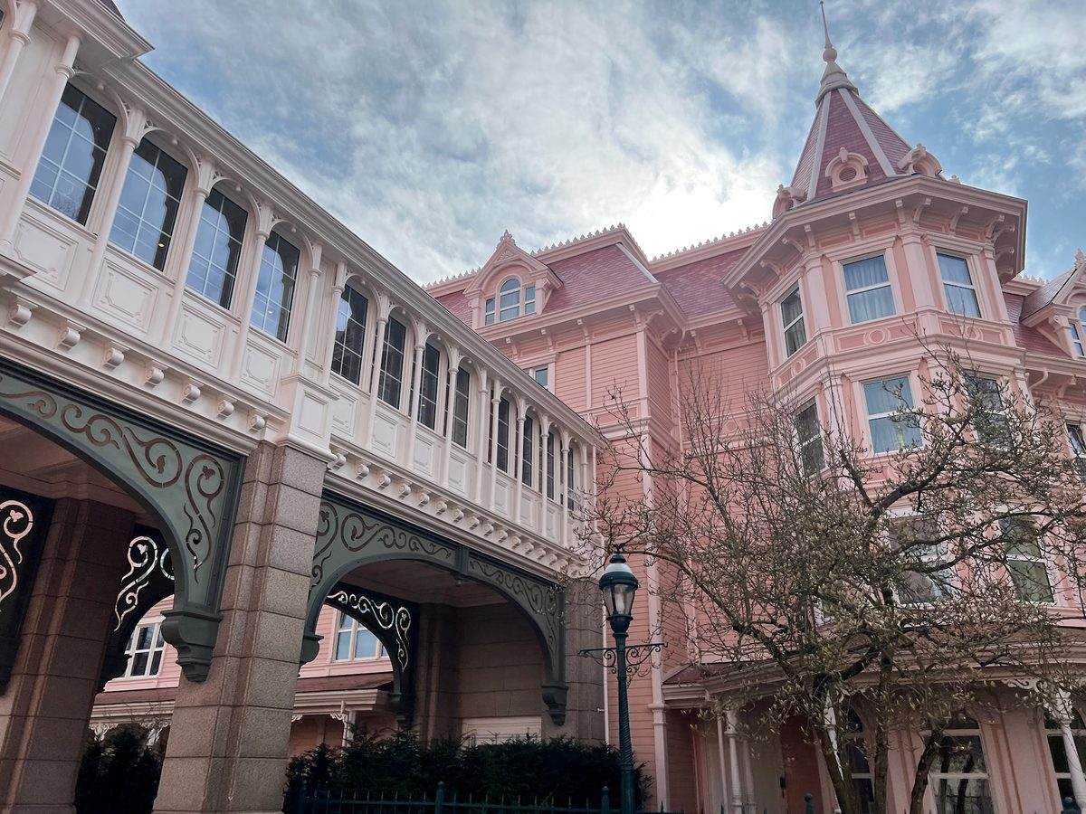The glazed white bridge between the wings of the Disneyland Hotel, crossing above the way into the park