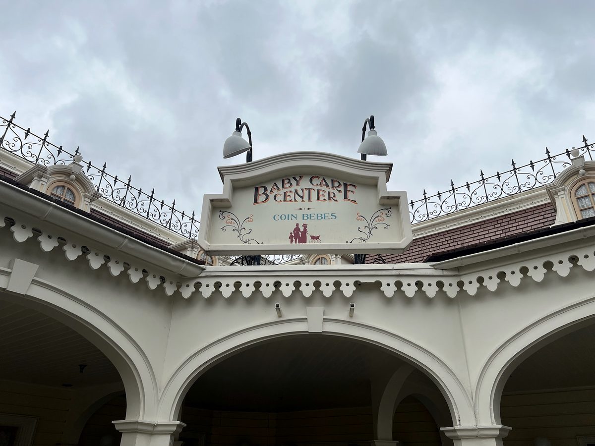 The Baby Care Center sign above its white colonnade at the castle end of Main Street