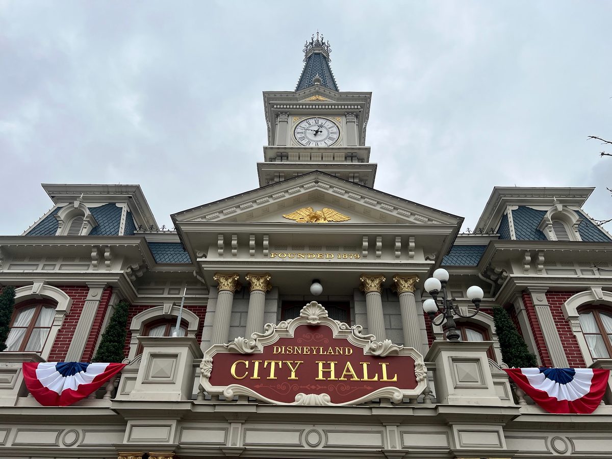The clock tower and sign of City Hall on Town Square