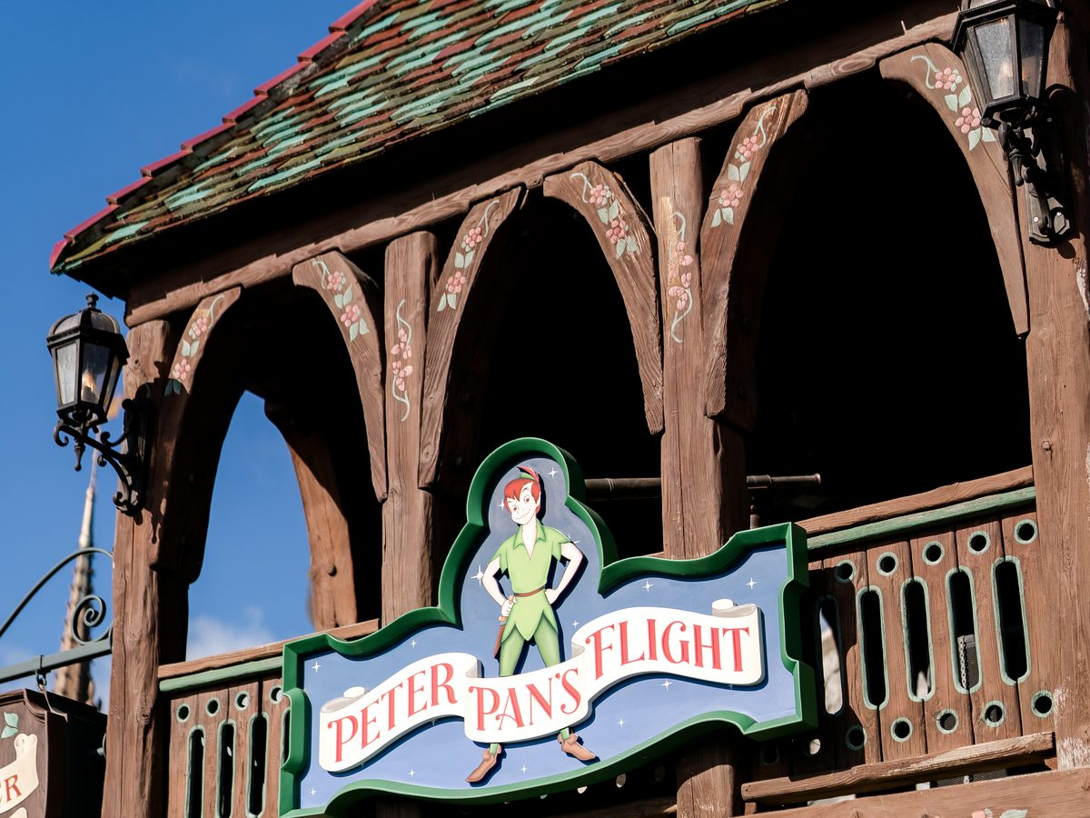The Peter Pan's Flight sign on the timbered balcony above the ride entrance