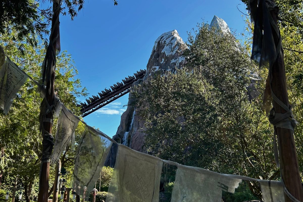 The snow-capped Expedition Everest mountain coaster rising over the Asia area at Animal Kingdom, a train on the outdoor track