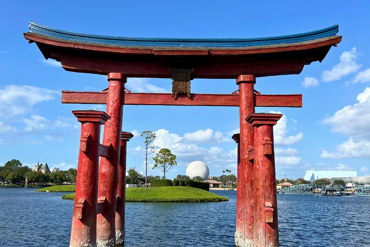 The five-storey pagoda and torii gate of the Japan pavilion at EPCOT’s World Showcase, beside the lagoon