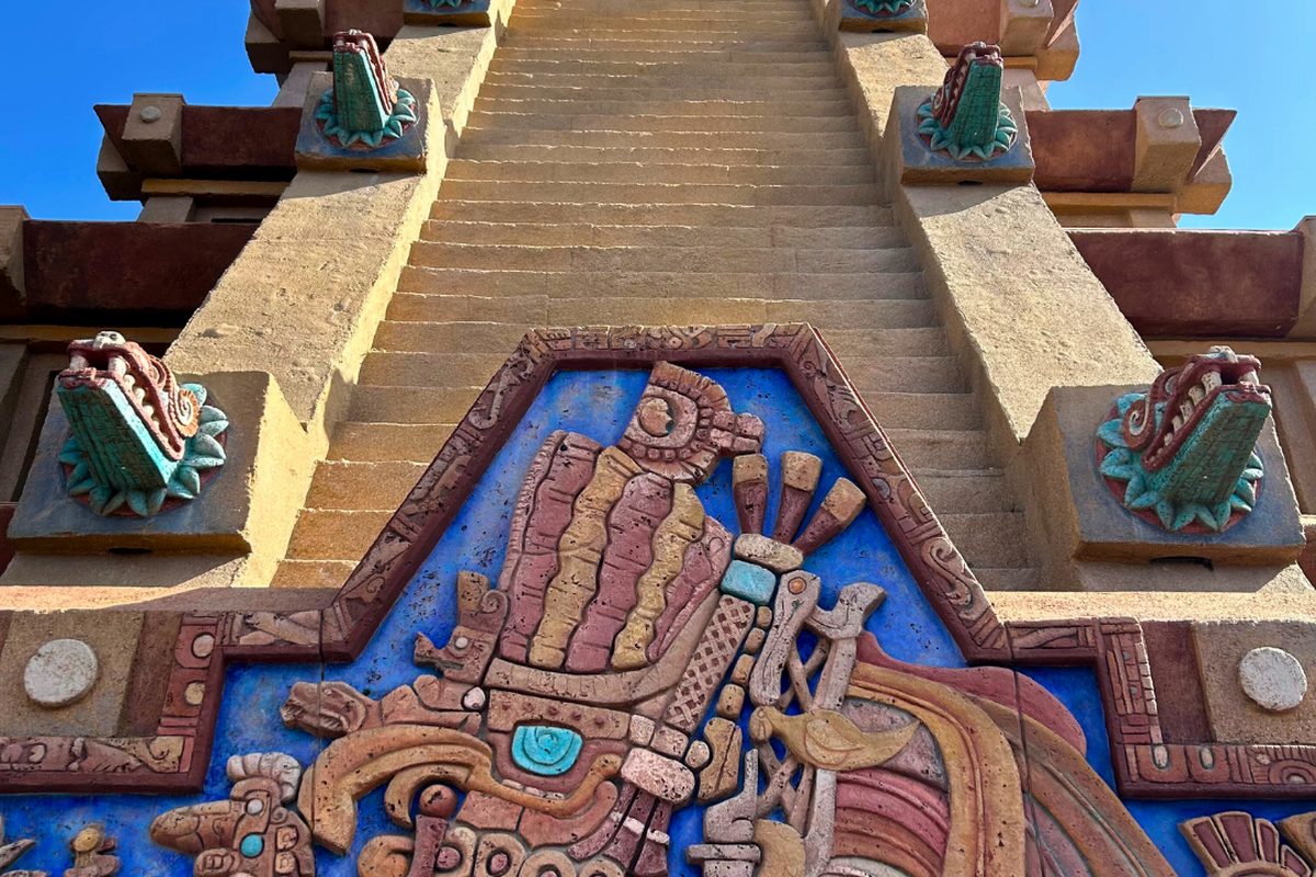 The carved stone relief and stepped side of the Mesoamerican pyramid at the Mexico pavilion in World Showcase