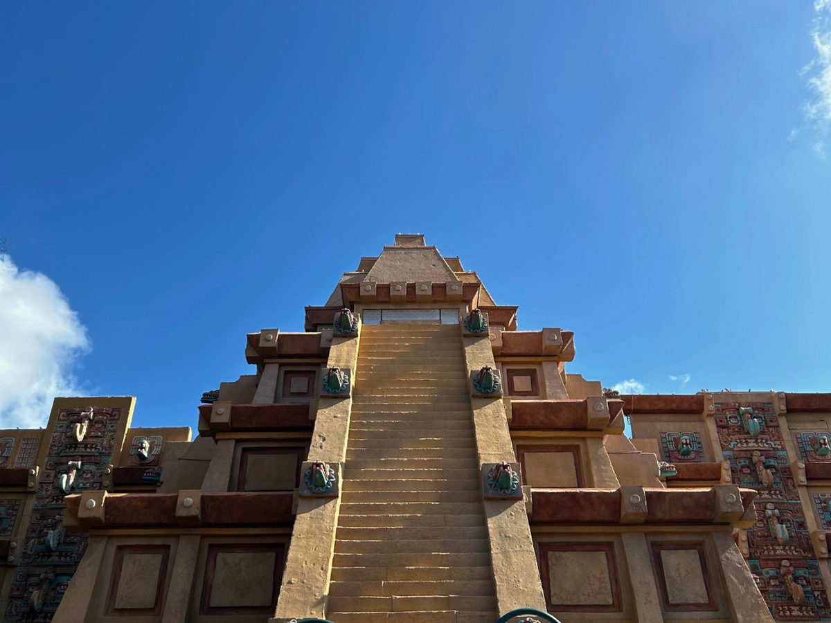 Looking up the central staircase of the Mesoamerican pyramid at the Mexico pavilion under a blue sky