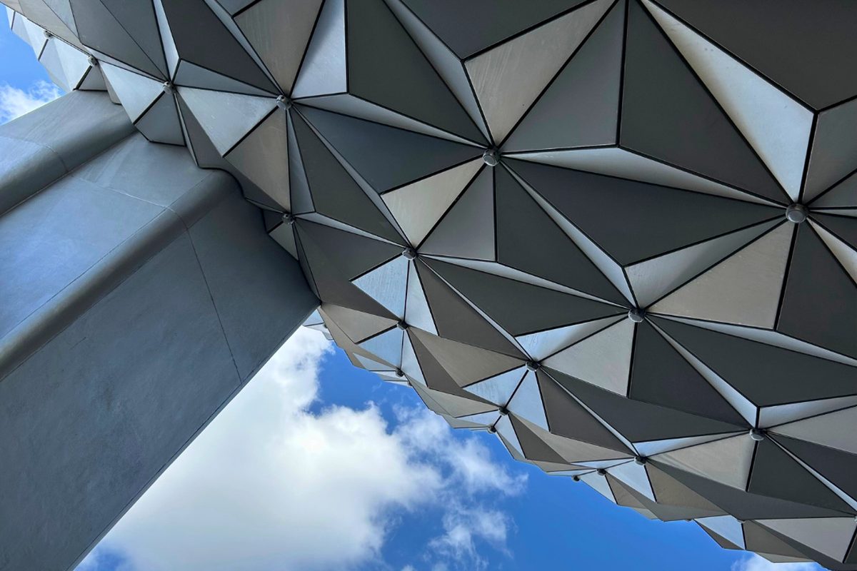 Spaceship Earth, the silver geodesic sphere at the entrance to EPCOT, with a monorail track passing in front of it