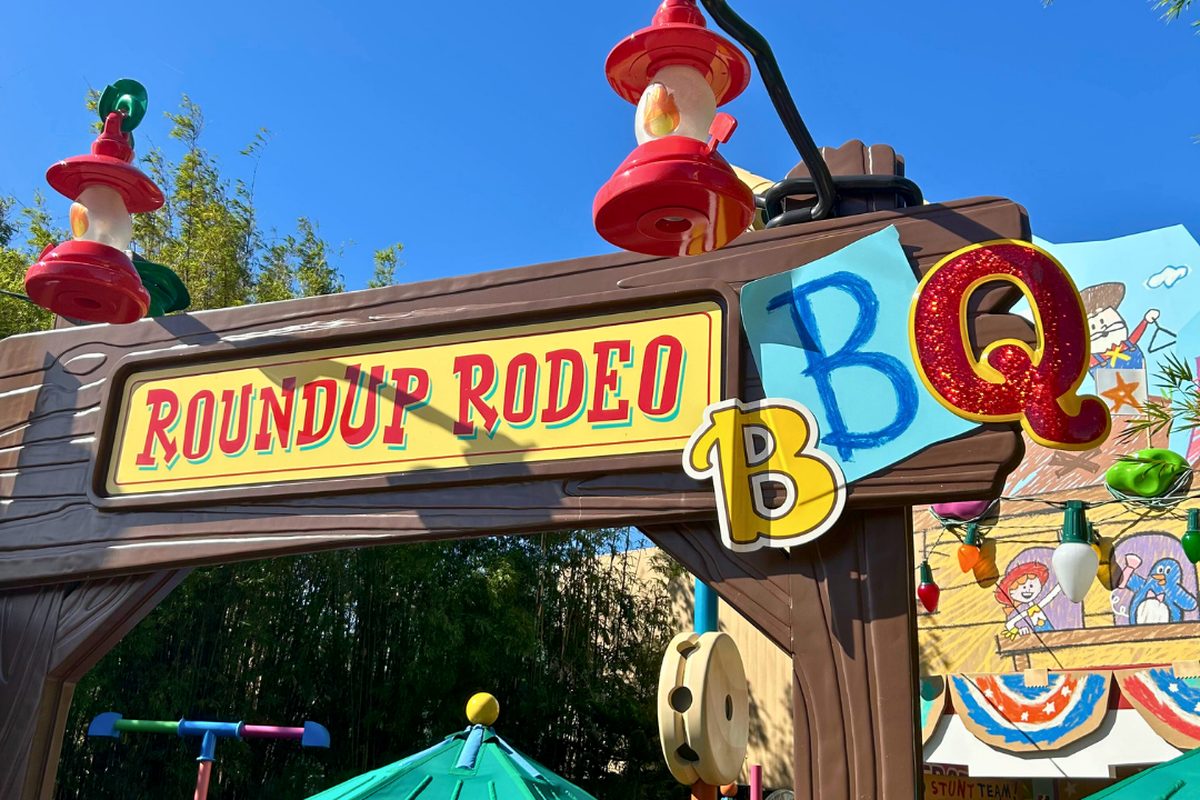 The toy-lettered entrance sign of Roundup Rodeo BBQ in Toy Story Land