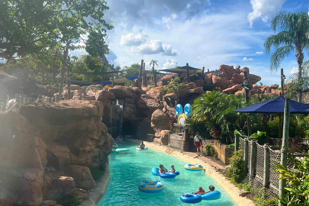 Guests floating on tubes along Castaway Creek, the lazy river at Typhoon Lagoon water park