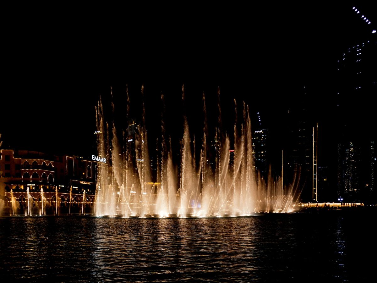 The free Dubai Fountain show below the Burj Khalifa at dusk