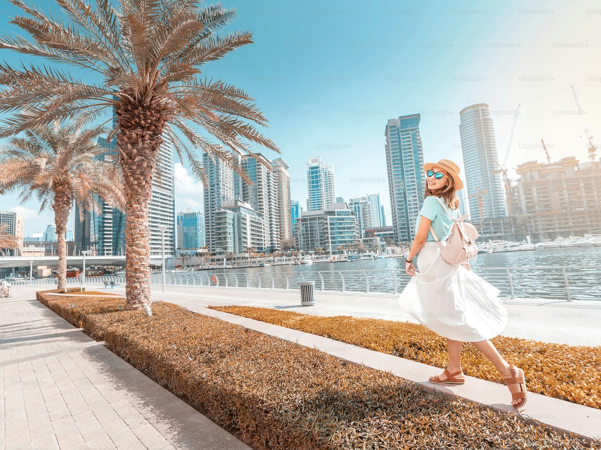A marina-side promenade of the kind families walk in the cooler months