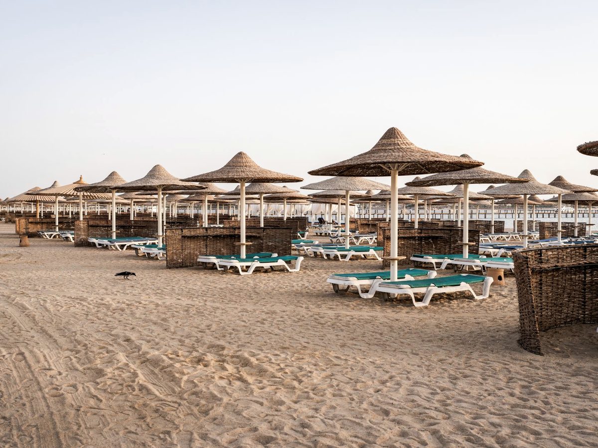 Straw parasols on a resort beach