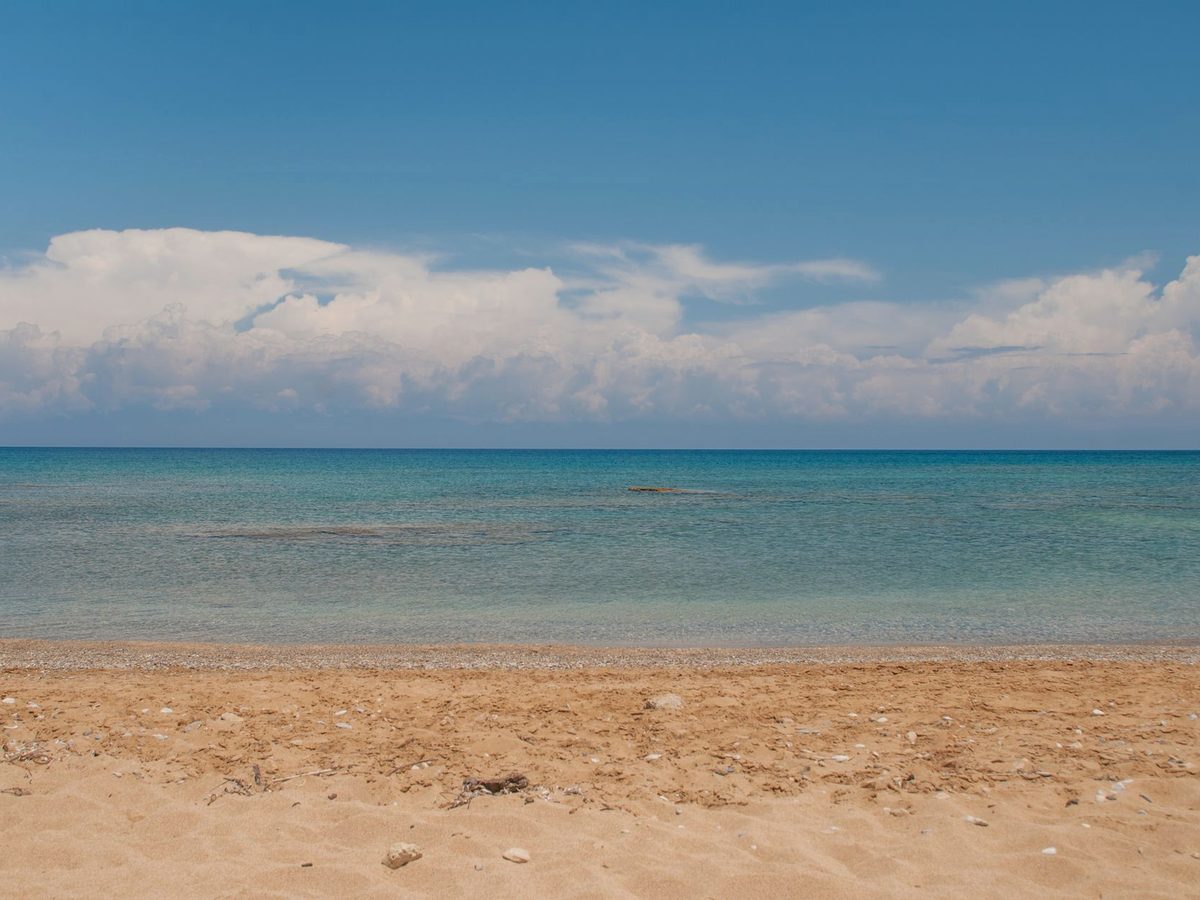 A quiet sandy stretch at the gentler end of the island