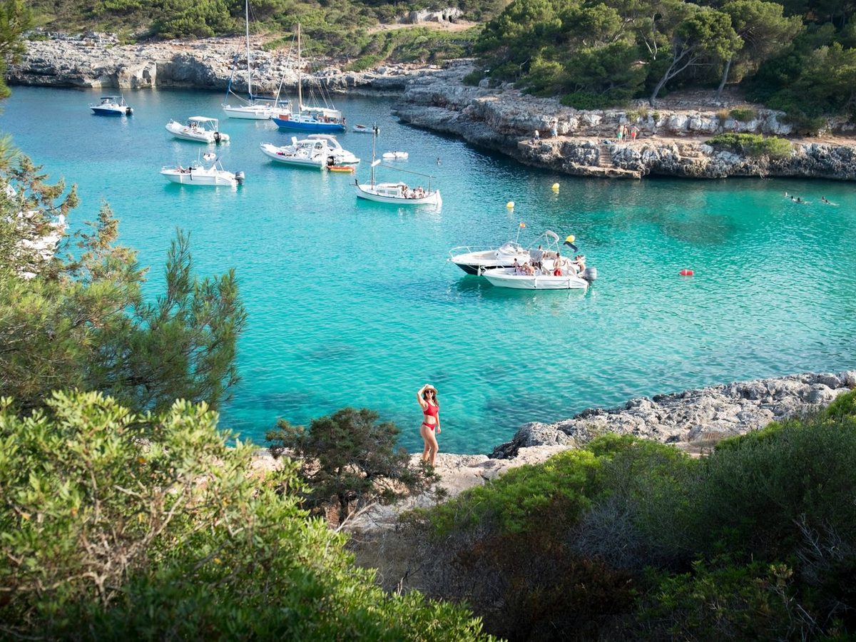 Boats at anchor in a turquoise cove