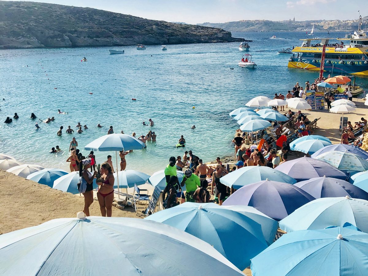 A typical busy sandy bay in high summer