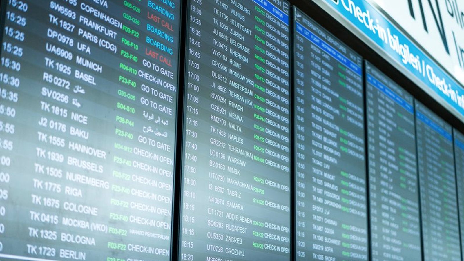 A departures board at a European airport listing flights