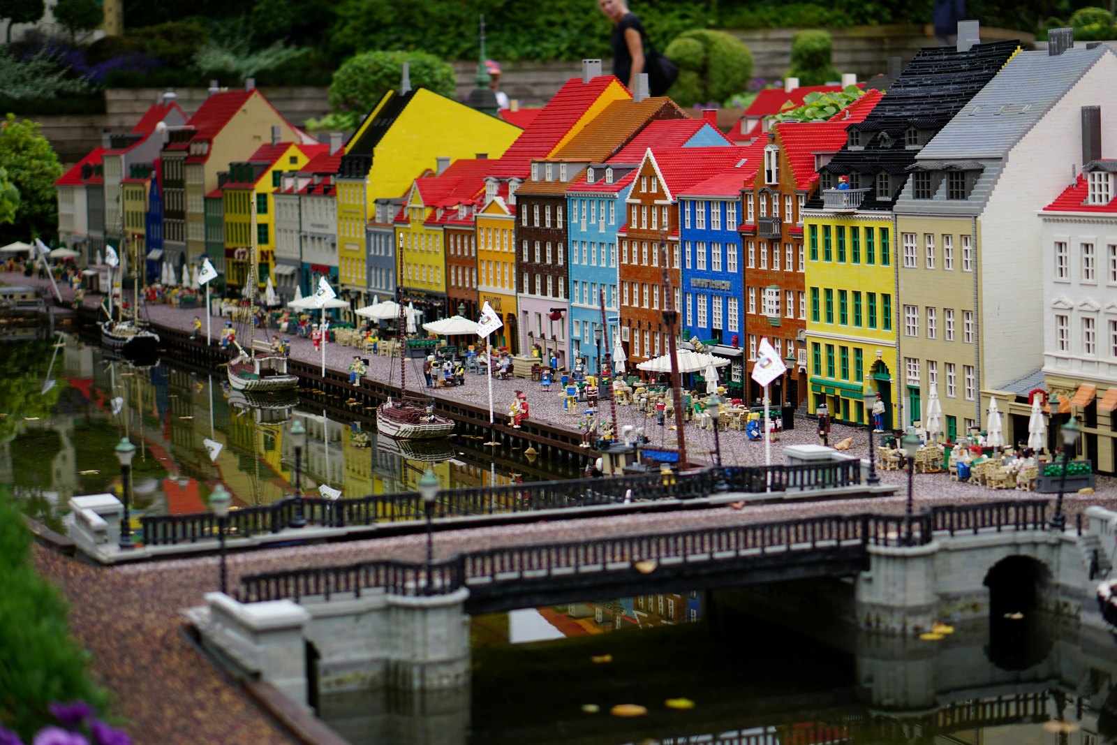 Colourful LEGO model buildings and a bridge over water at LEGOLAND Billund