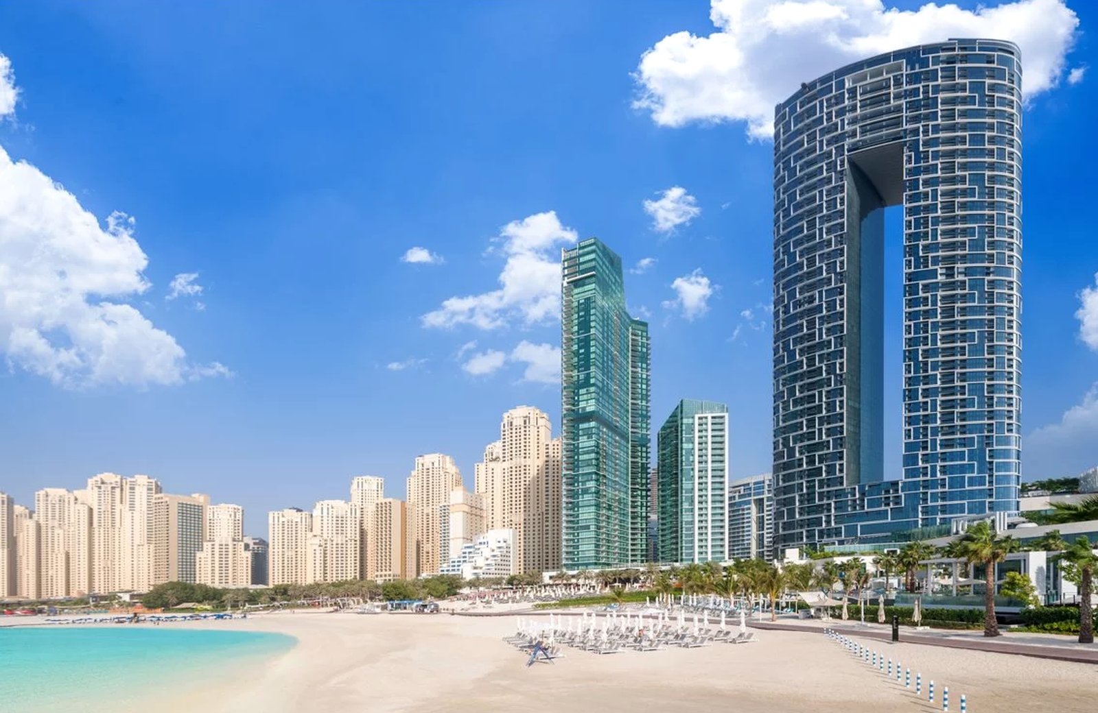 Address Beach Resort: two linked high-rise towers on the JBR seafront in Dubai, above a beach and the Arabian Gulf.