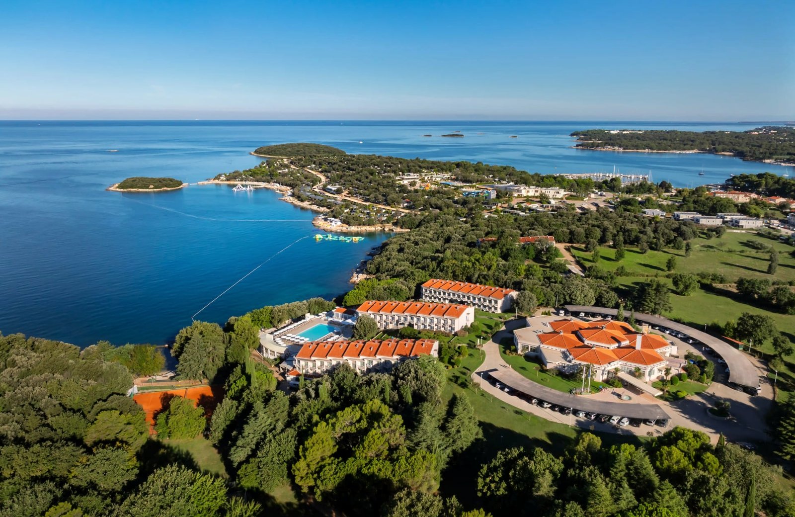 All Inclusive Resort Funtana: pavilions of balconied rooms in Mediterranean gardens sloping down to the pools and the Istrian coast.