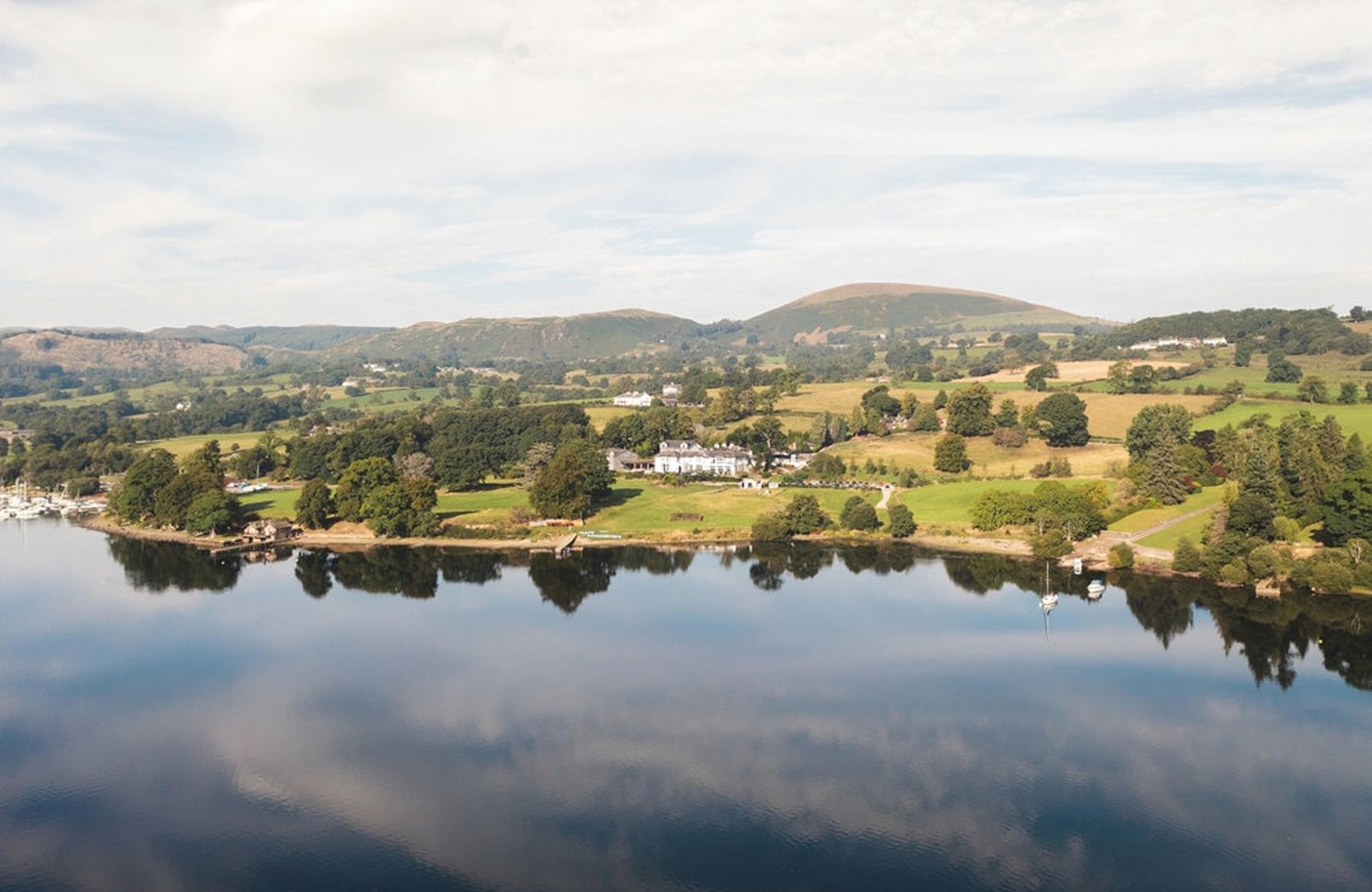 Another Place, The Lake on the shore of Ullswater, a Georgian house and contemporary wing in wooded grounds above the water and the fells.