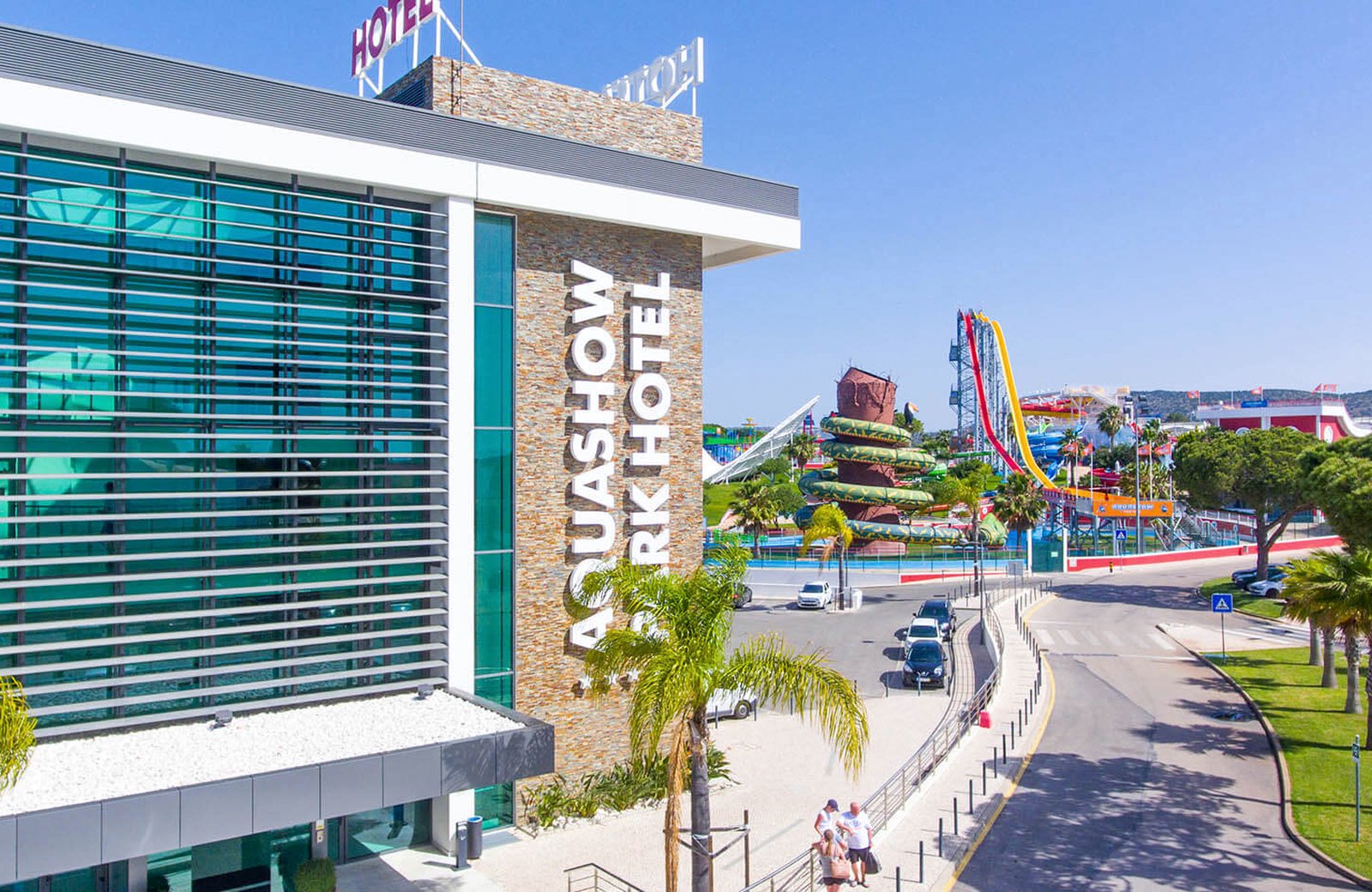 Aquashow Park Hotel at Quarteira, a four-storey hotel beside its outdoor water park with slides and pools.