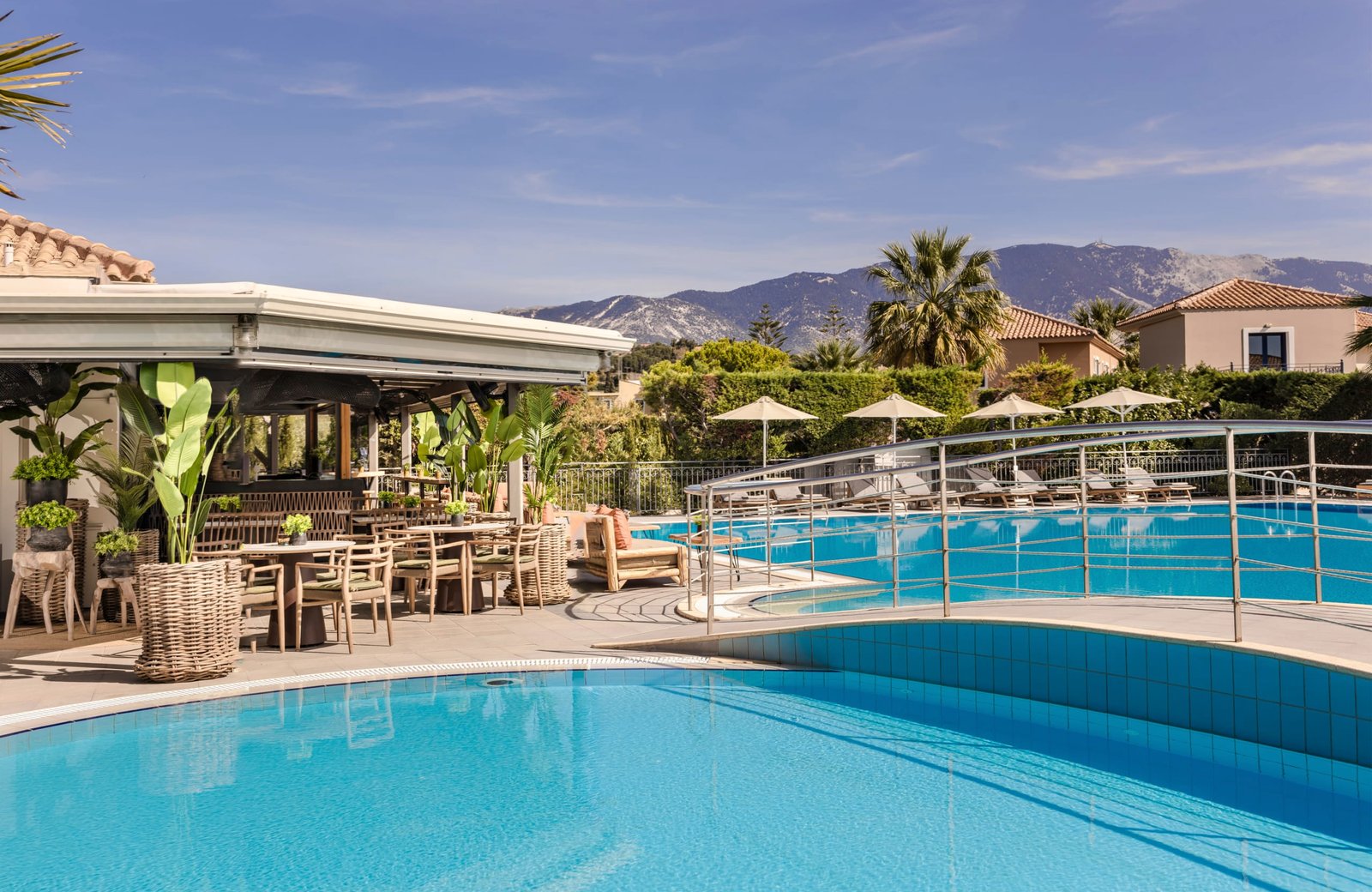Avithos Resort in Svoronata, Kefalonia: low-rise buildings in olive-grove gardens around a freshwater pool.