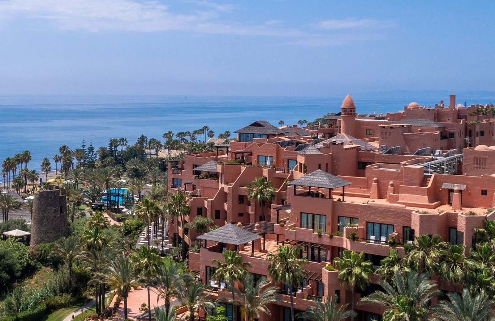 Hacienda del Mar at Estepona: a low-rise terracotta-coloured hotel in subtropical gardens that step down past the pools to the Mediterranean.
