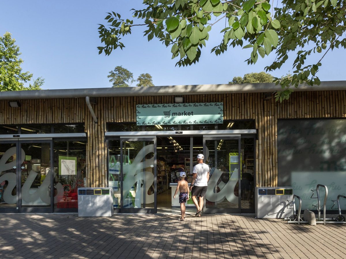 The glass entrance of the resort's market grocery shop.
