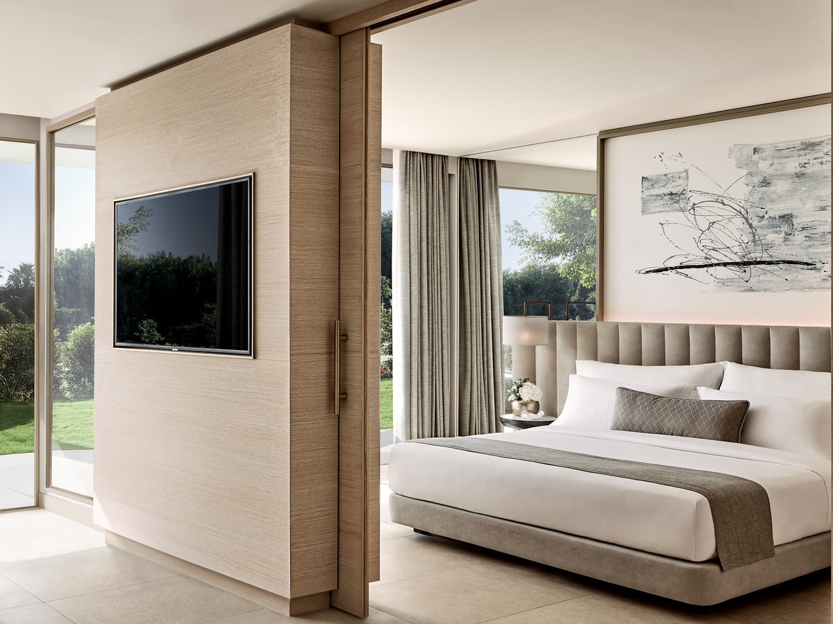 A One Bedroom Suite Private Garden at Ikos Andalusia, the bedroom with planted garden through the windows on both sides.