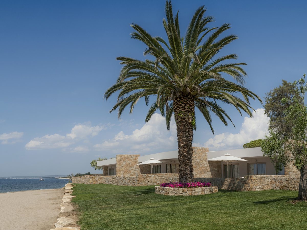 The beach and the bungalows at Ikos Olivia