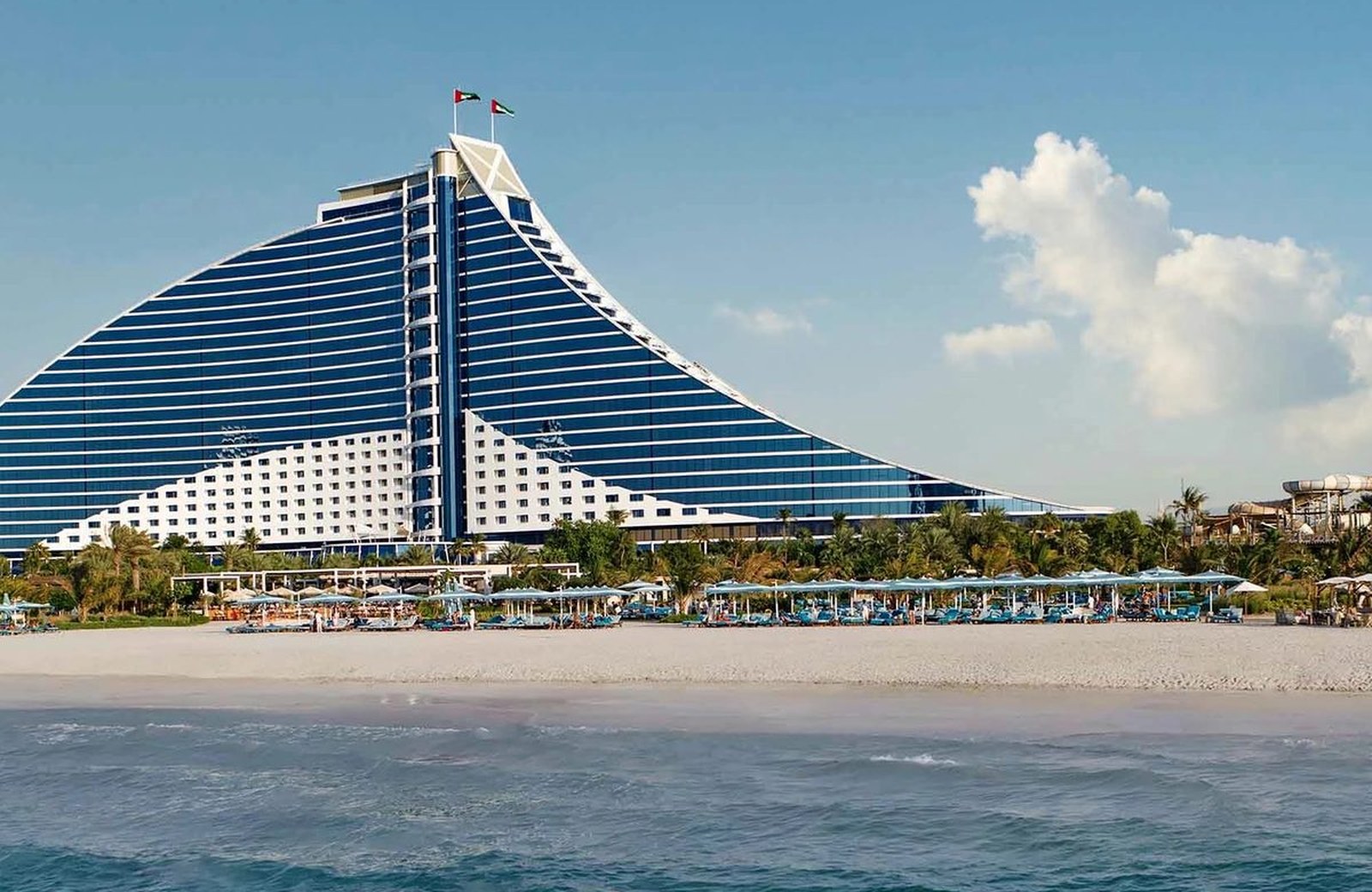Jumeirah Beach Hotel: a five-star, wave-shaped tower rising above a private Arabian Gulf beach in the Umm Suqeim area of Dubai.