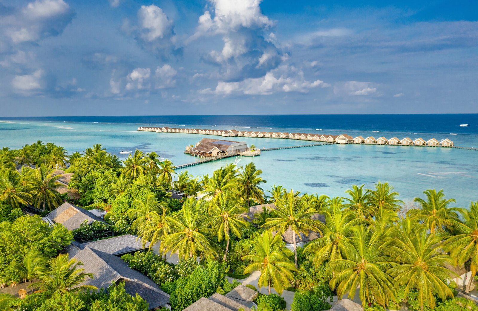 LUX* South Ari Atoll: villas along a sandy island and reaching out over a turquoise lagoon in the South Ari Atoll of the Maldives.