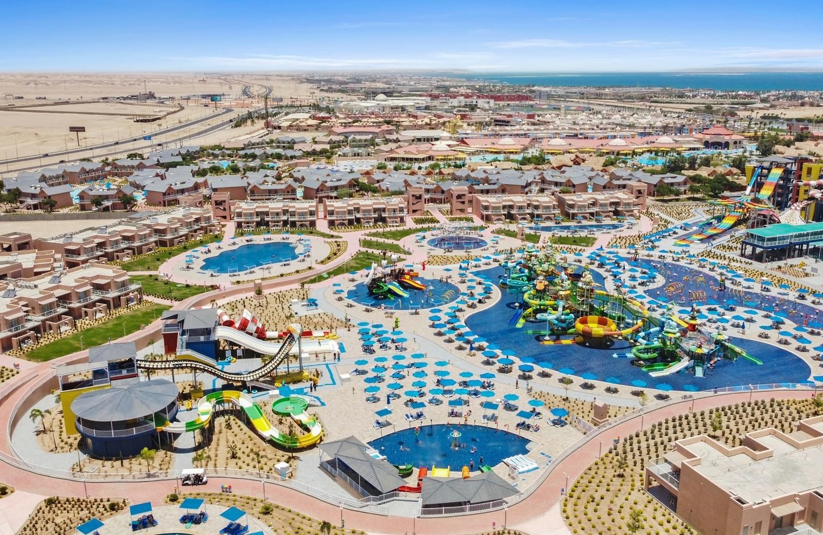 Pickalbatros Jungle Aqua Park Resort in Hurghada, with bungalow rooms set around the pools and waterpark slides beyond.
