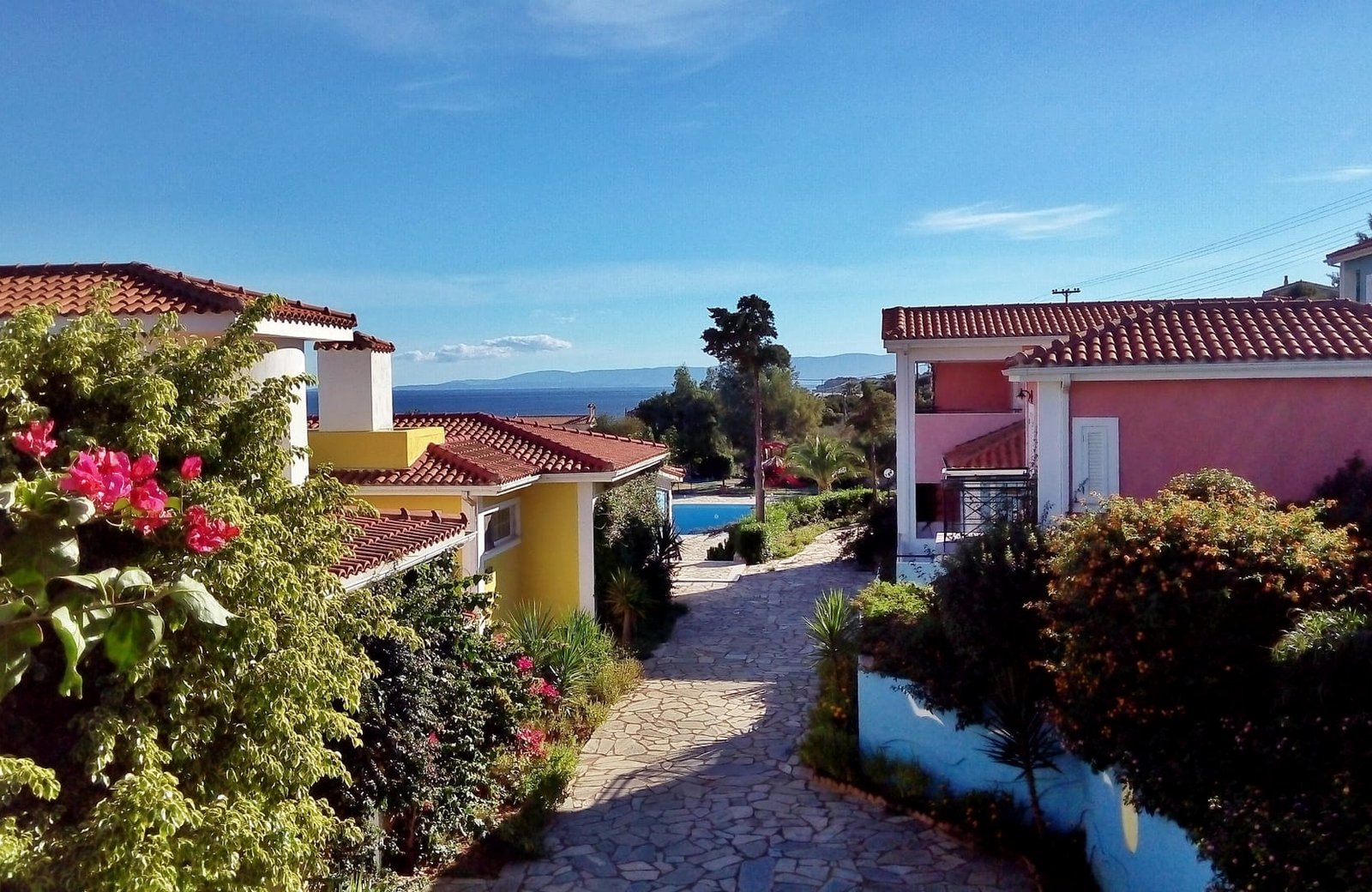 Porto Skala Hotel & Village, low-rise pastel blocks on a hillside above the Ionian Sea near Skala in south-east Kefalonia.