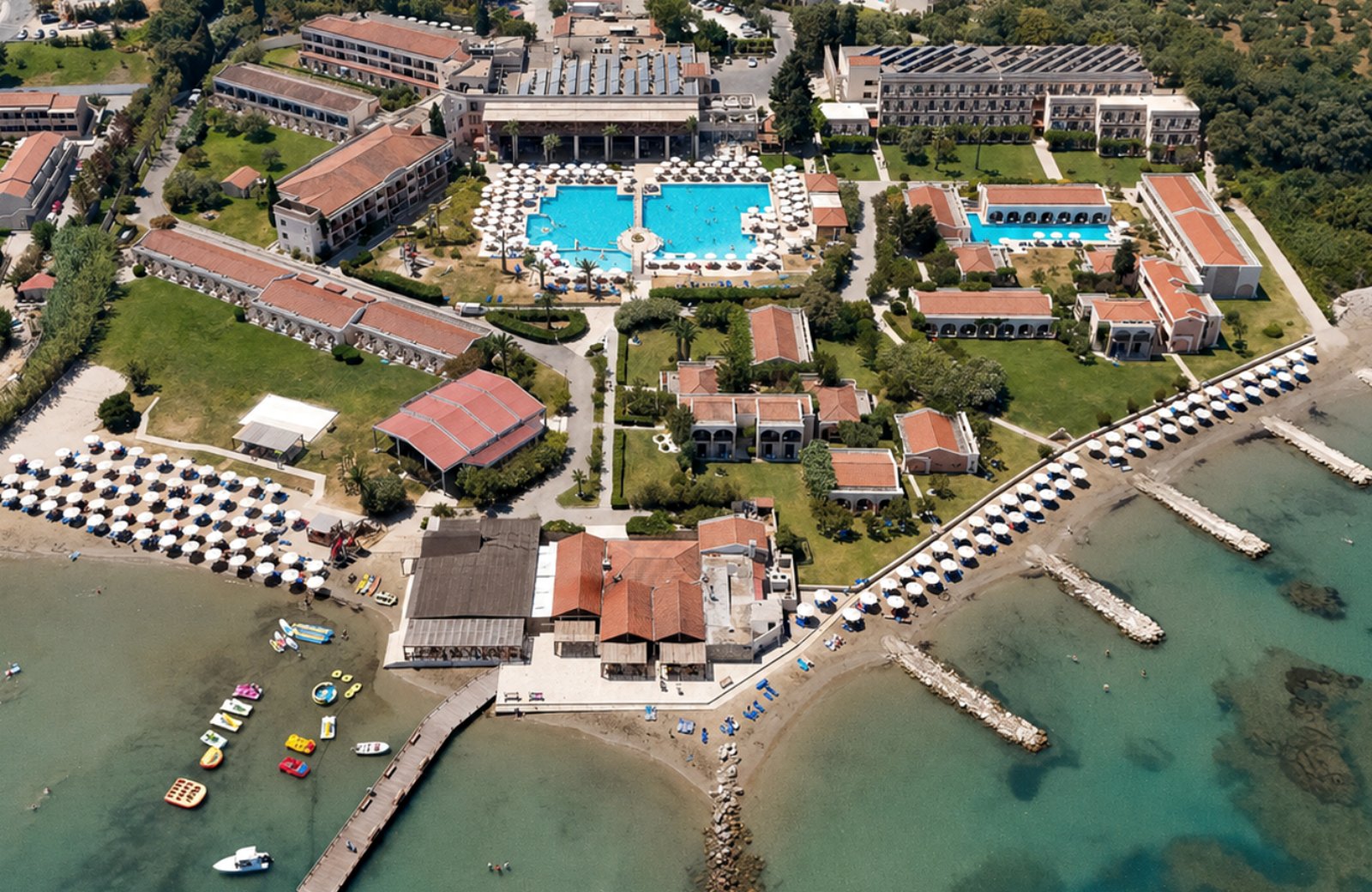 Roda Beach Resort & Spa spread across its forest estate on the north coast of Corfu, with pools and gardens running down to a sandy beach.