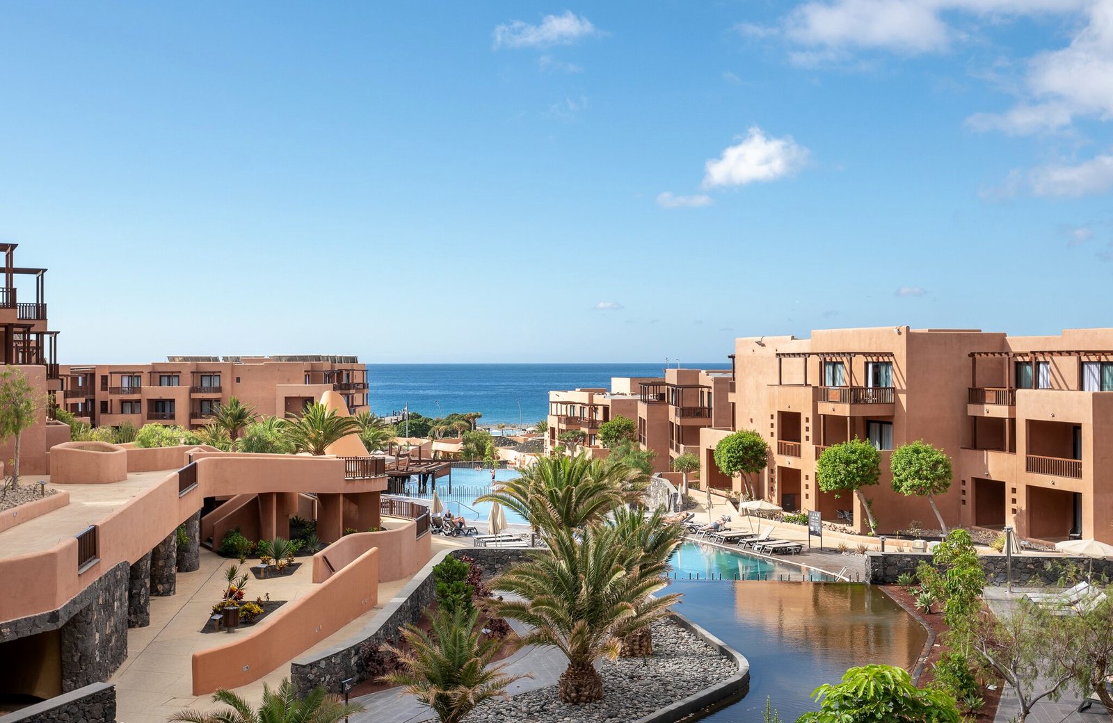 Barceló Tenerife, the terraced terracotta buildings of the resort stepping down towards the sea.