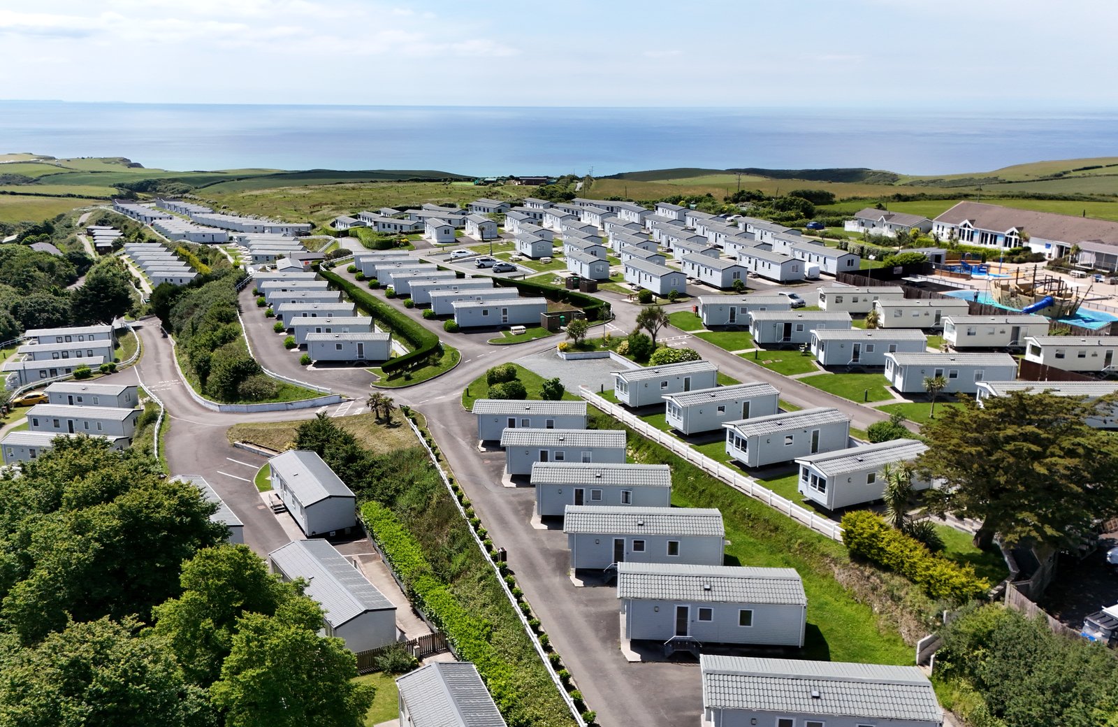 Sandymouth Holiday Resort on the north Cornwall clifftops near Bude, its caravans and lodges spread across a meadowland site above the sea.