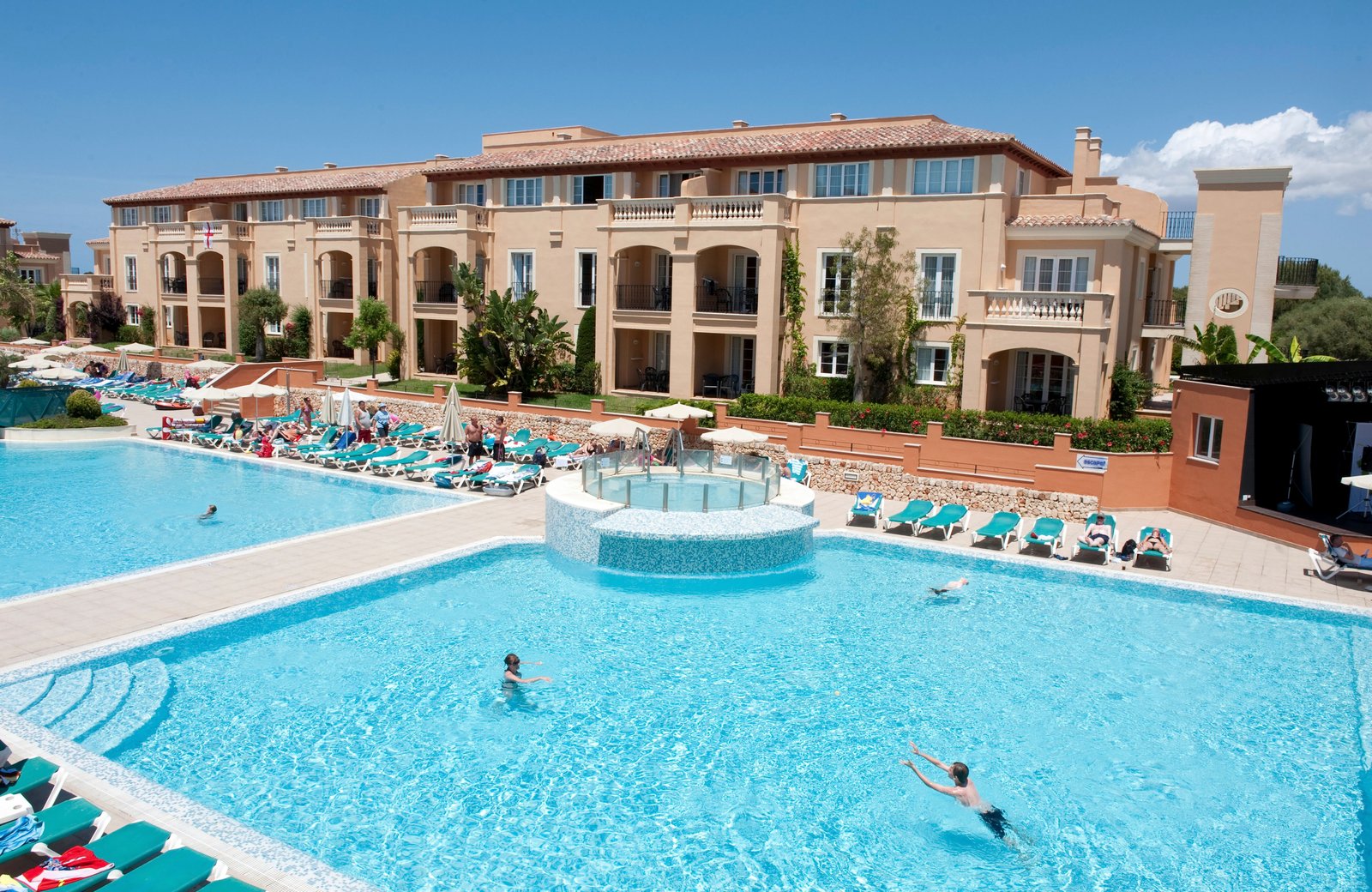 TUI BLUE Grupotel Turquesa Mar in Son Xoriguer, Menorca: low-rise all-inclusive blocks around the pool area near the Cala'n Bosch marina.