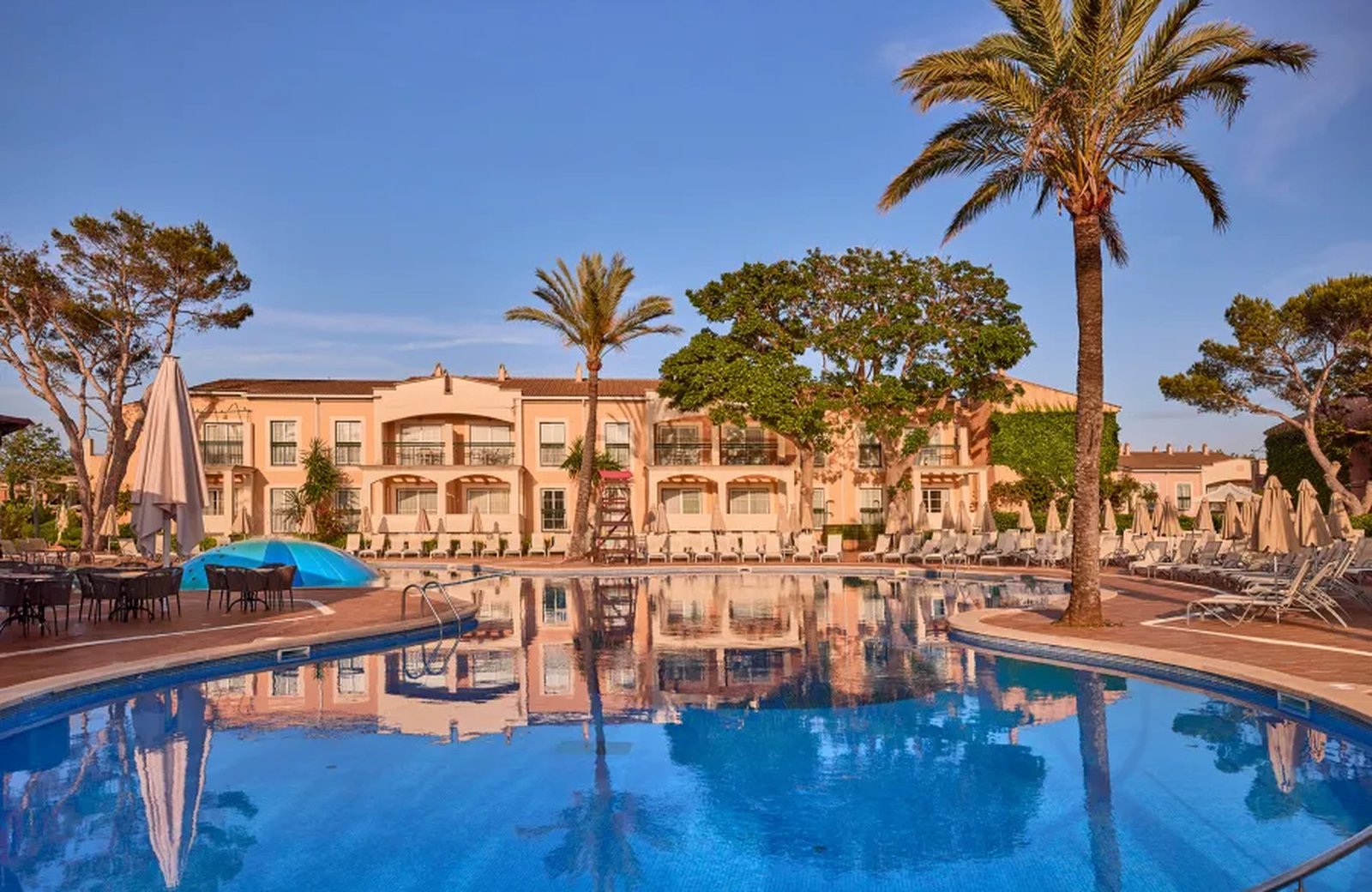 Zafiro Menorca at Cala'n Bosch: low-rise apartment blocks around gardens and pool areas on the south-west coast of Menorca.