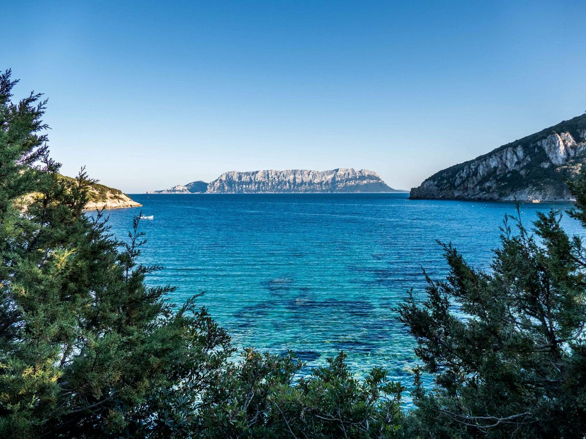 Tavolara island rising across the bay near San Teodoro